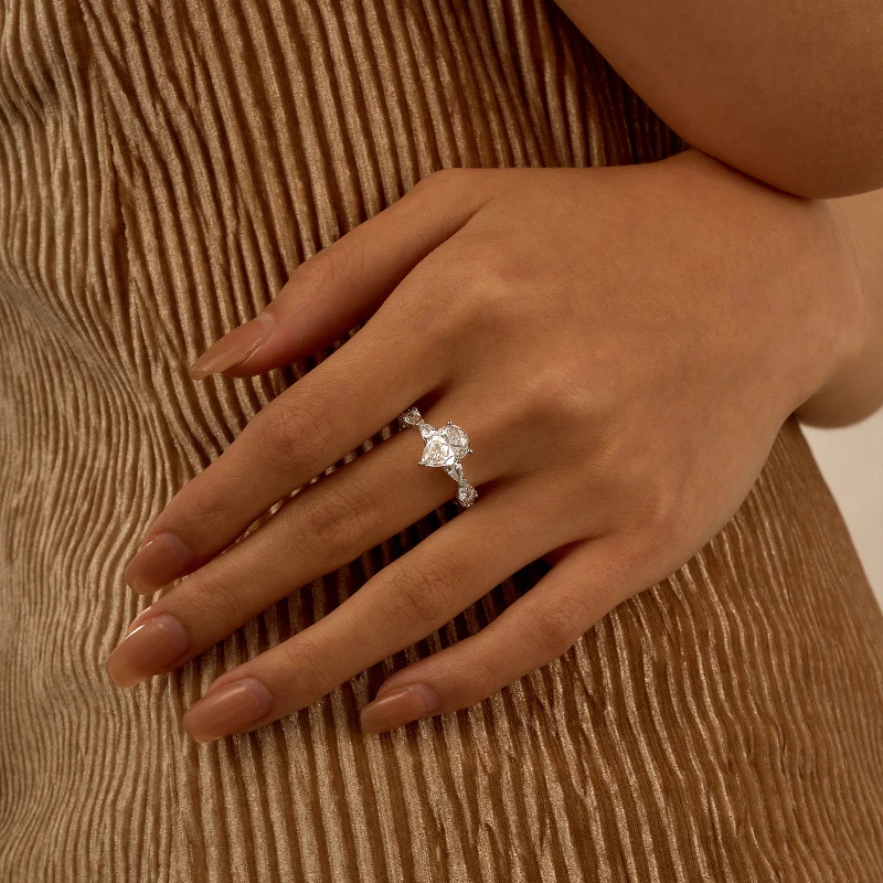Nature Inspired Pear Cut Moissanite Ring with Full Accent Stones - Image 14