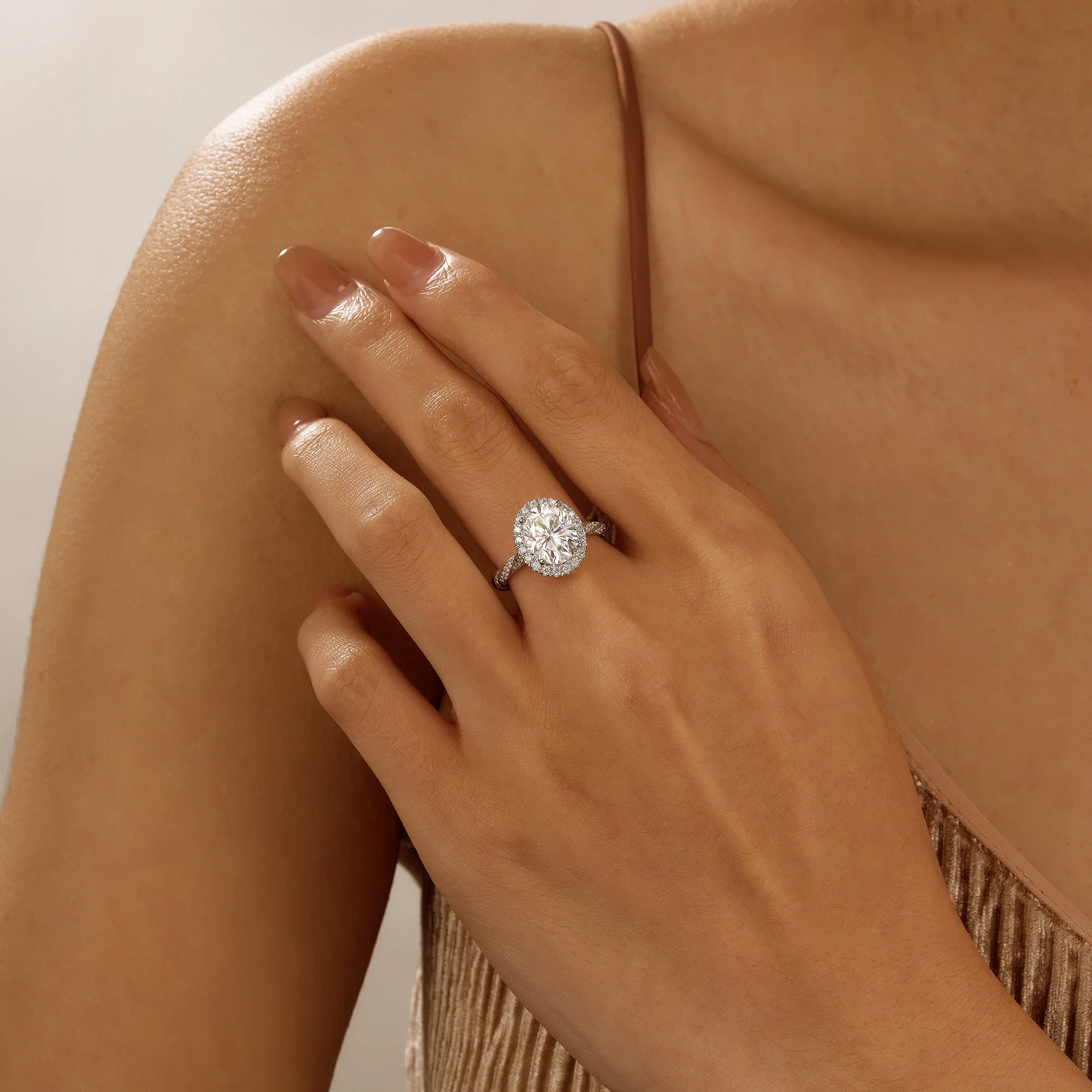 Oval Halo Moissanite Engagement Ring with Twisted Pavé Band - Image 10